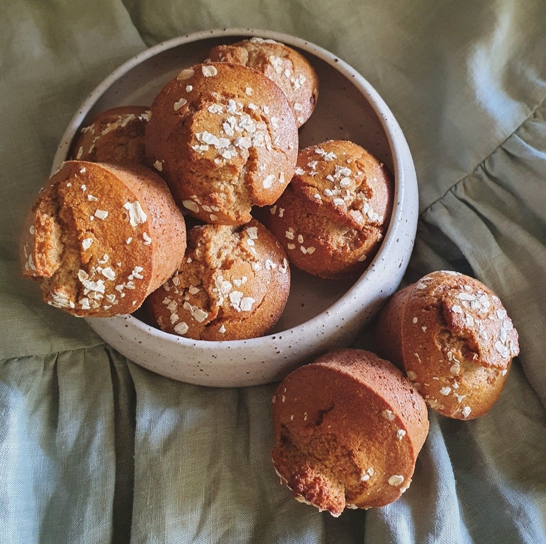 Beltane Vegan Oat Honey Cake on linen and ceramic plate